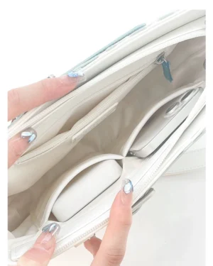 Interior compartment close-up of Jirai Kei ita bag showing organized storage pockets and zippered slots for daily essentials