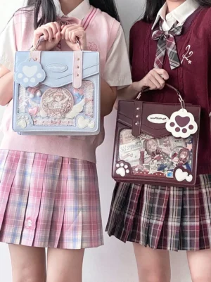 two girls wearing jirai kei jk school uniforms with matching cat paw ita bags clear display windows light blue wine red colors