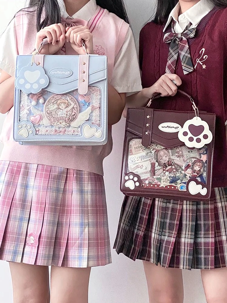 two girls wearing jirai kei jk school uniforms with matching cat paw ita bags clear display windows light blue wine red colors