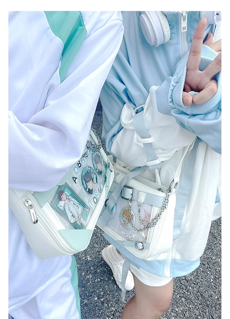 Female model wearing light blue Jirai Kei ita bag in casual Harajuku street style with adjustable crossbody strap