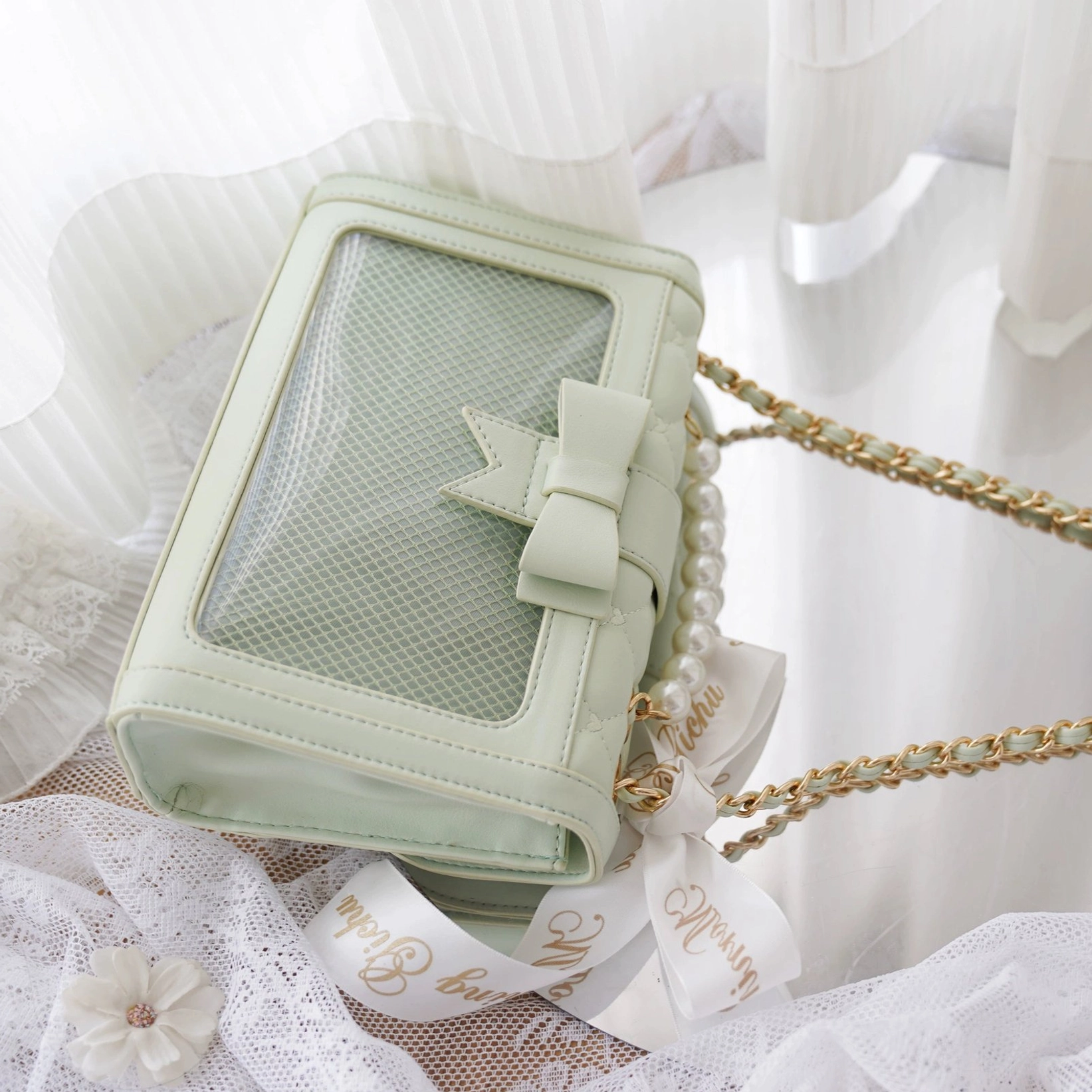 Jirai kei ita shoulder bag interior storage layout showing removable mesh divider and dual compartment organization