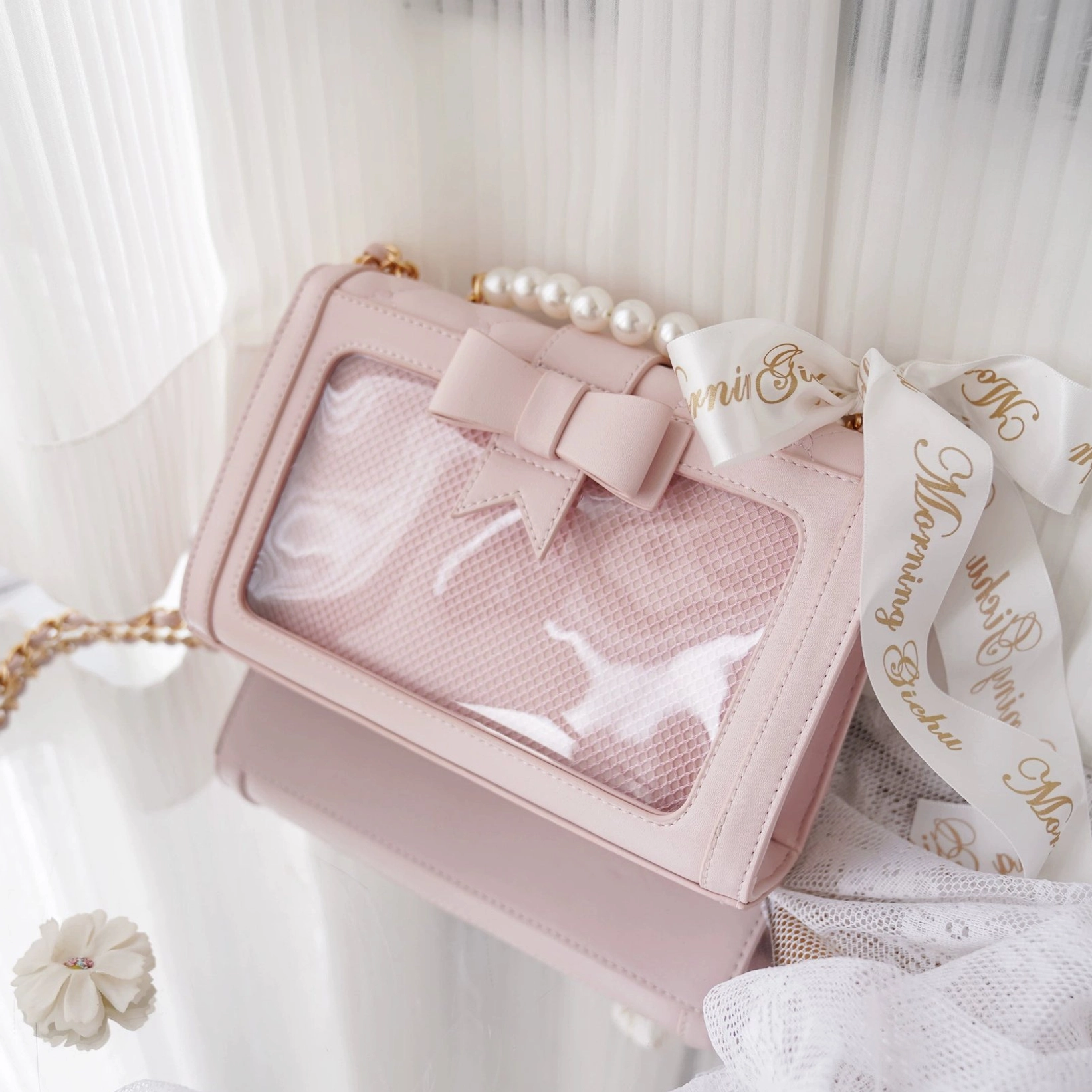 Light blue pastel jirai kei ita shoulder bag with removable bow and transparent compartment design