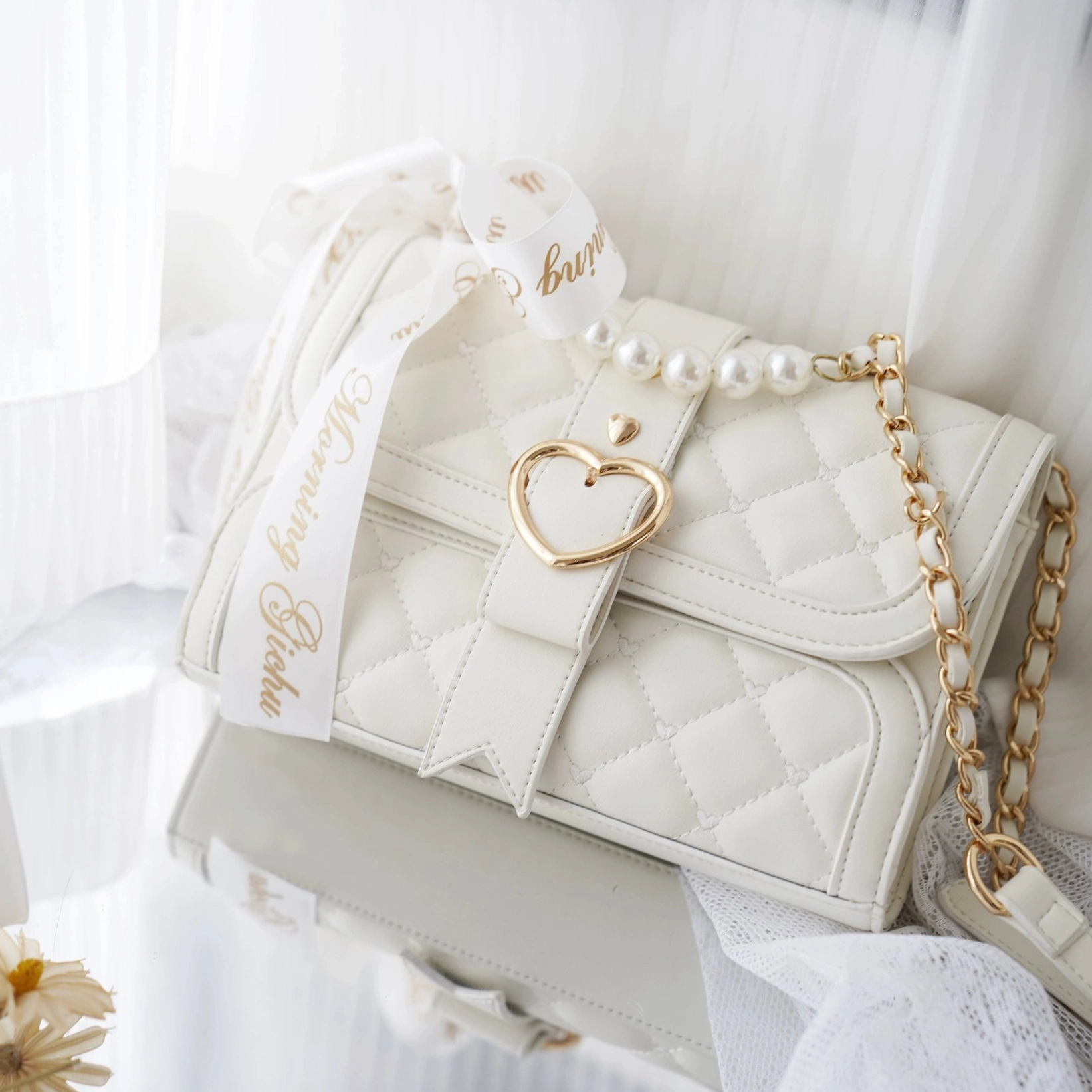 Matte white jirai kei ita shoulder bag with soft finish showing bow decoration and transparent display window