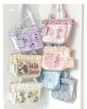 Anime-themed Jirai Kei itabag tote collection wall display featuring ruffled satin trim and clear card display windows in multiple vibrant colors