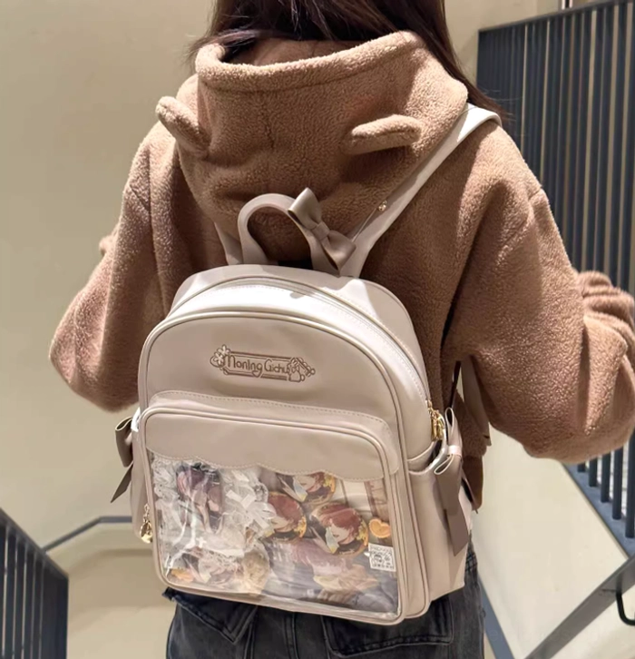 Jirai Kei transparent itabag beige leather finish clear anime display pocket rear full-body view indoor stairwell