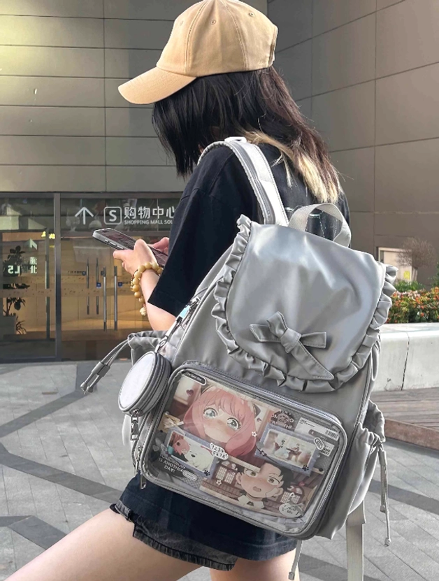 Jirai Kei itabag transparent window display showcase with curated badge and figure collection arrangement