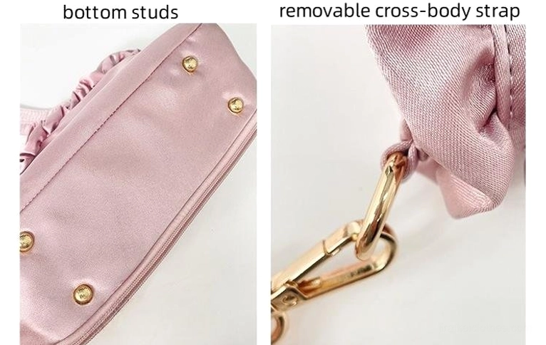 Jirai Kei itabag hardware details flat lay showing gold-toned bottom protective studs and detachable adjustable crossbody strap