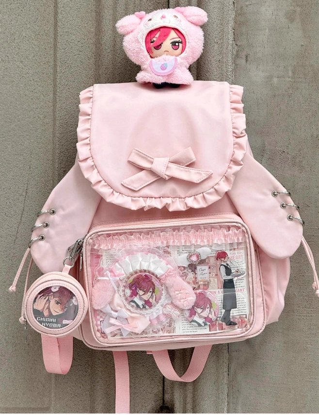 Jirai Kei bunny ear itabag backpack packed with displayed badges and collectible figures in transparent showcase window
