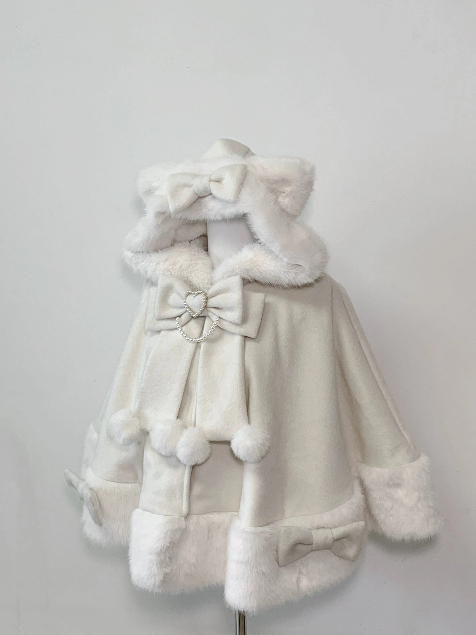 Ivory cream white Jirai Kei cat ear hooded plush cape with white fuzzy fur trim and heart crystal bow embellishment
