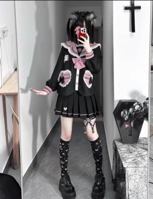 Gothic Jirai Kei JK sailor uniform full-body front mirror selfie with black cat ear wig, pleated skirt with heart embroidery, and thigh leg ring accessory