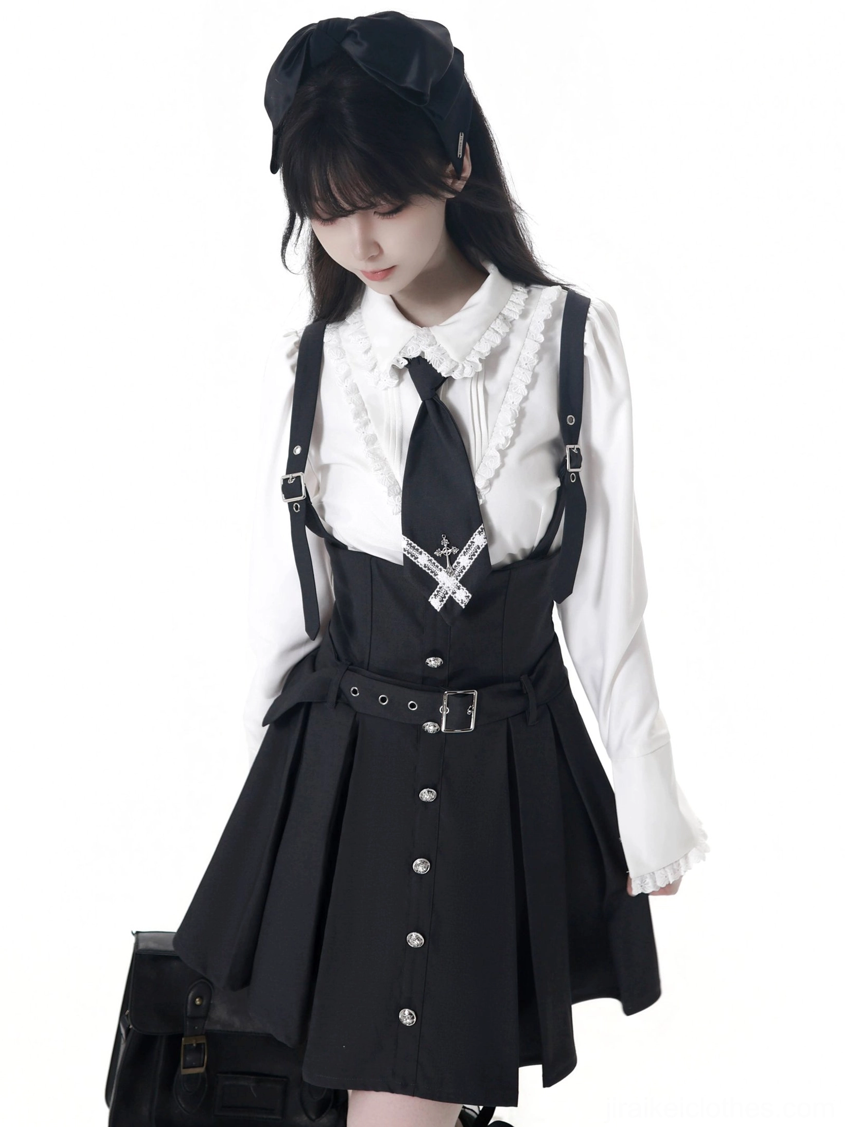 Jirai Kei JK uniform cross-adorned tie detail in black showing traditional school tie design with cross emblem and elegant drape on female model