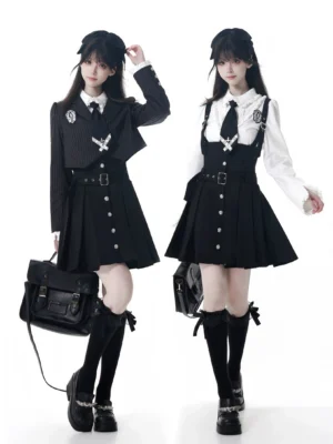 Jirai Kei JK uniform set front and side view featuring pinstriped cropped blazer, white blouse with ruffles, pleated suspender skirt, and cross-adorned tie on two female models with studio white background and leather accessories