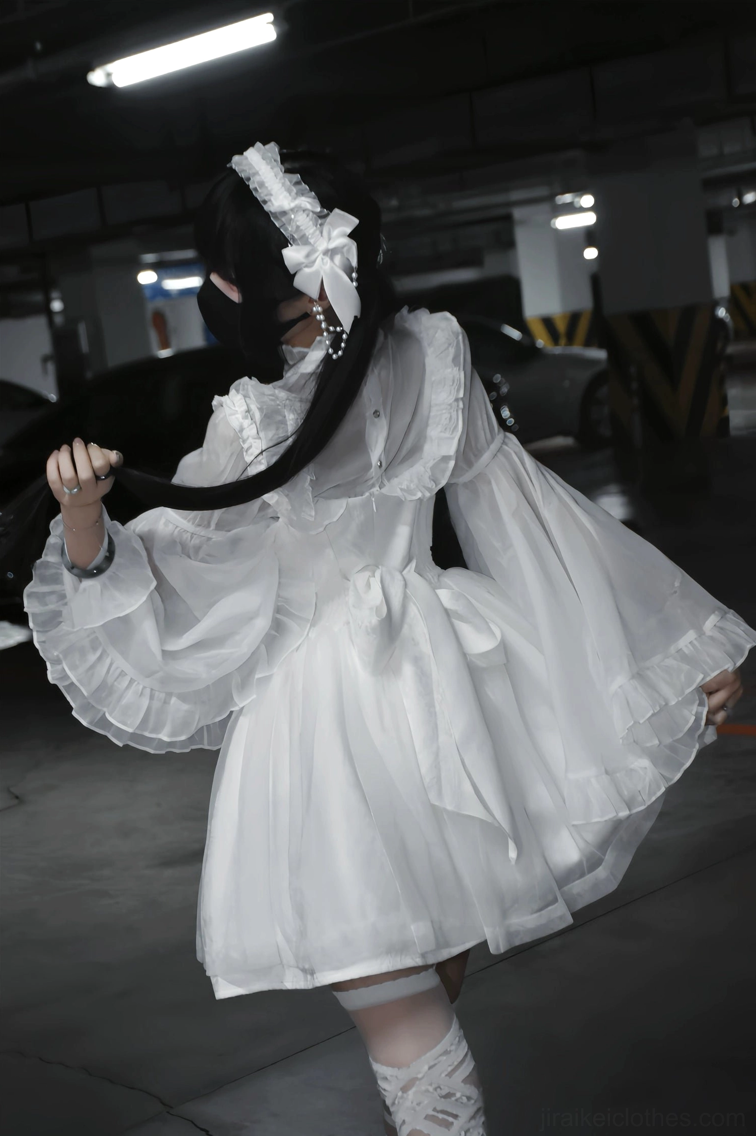 Jirai Kei jumper dress textured jacquard construction and metallic stud accents scattered across bodice detail view