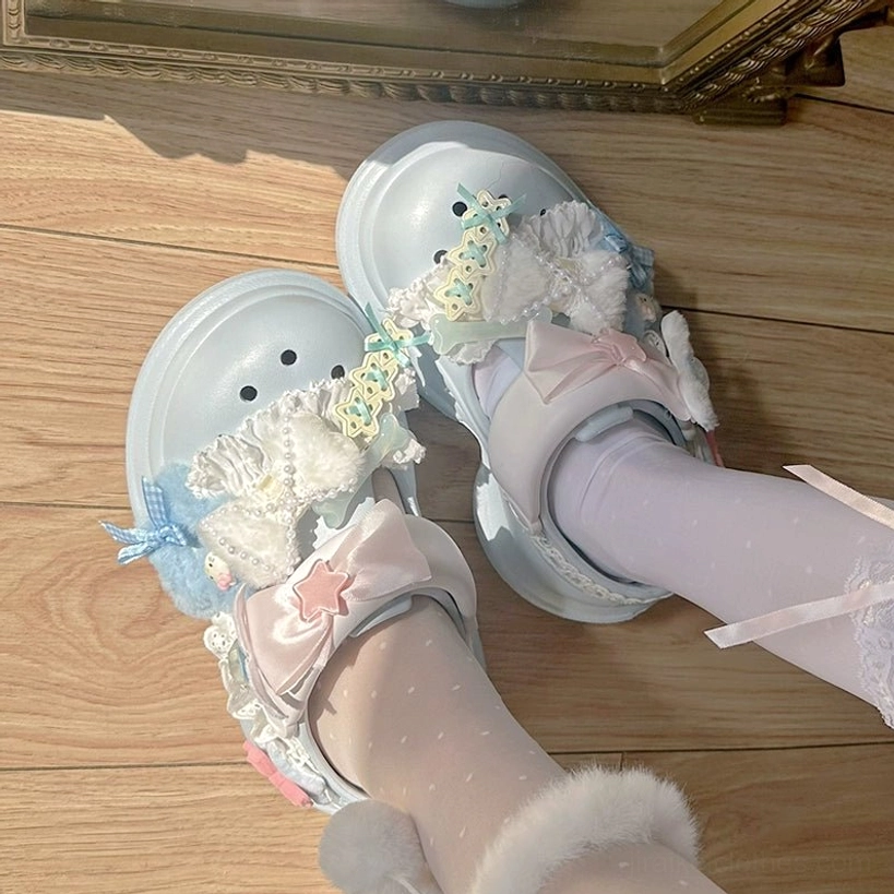 Jirai Kei-inspired kawaii platform clog sandals with thick EVA sole, adjustable heel strap, lace and pom-pom embellishments in multiple pastel shades