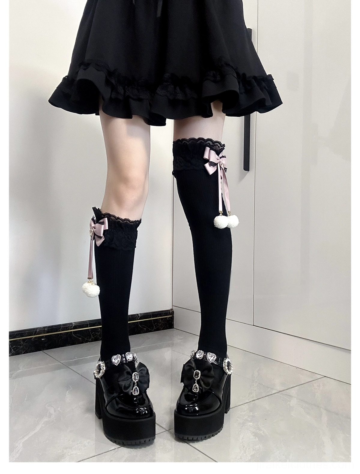 Jirai Kei knee-high socks black-pink colorway styling view worn with black ruffled skirt and platform shoes showing sock height and lace cuff proportion