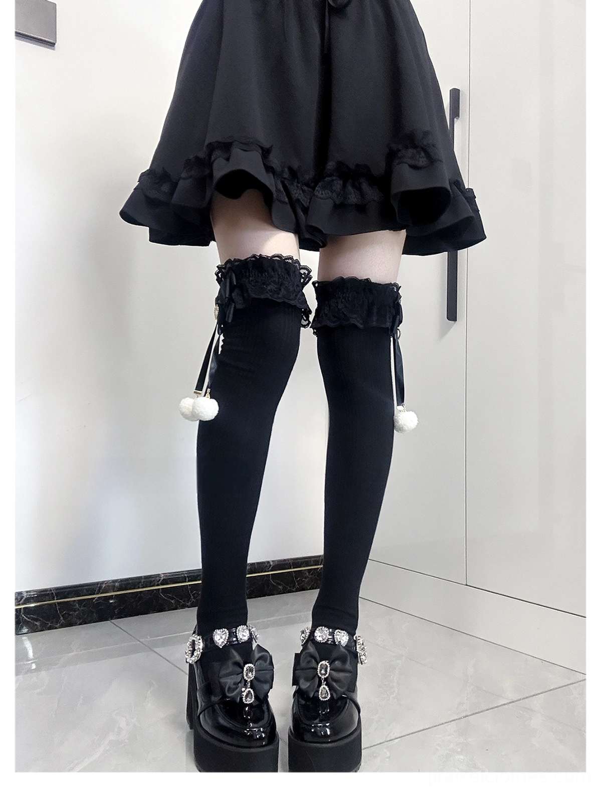 Jirai Kei lace bow pom-pom knee-high socks close-up detail shot showing delicate lace cuff texture pink bow accent and white pom-pom decoration craftsmanship