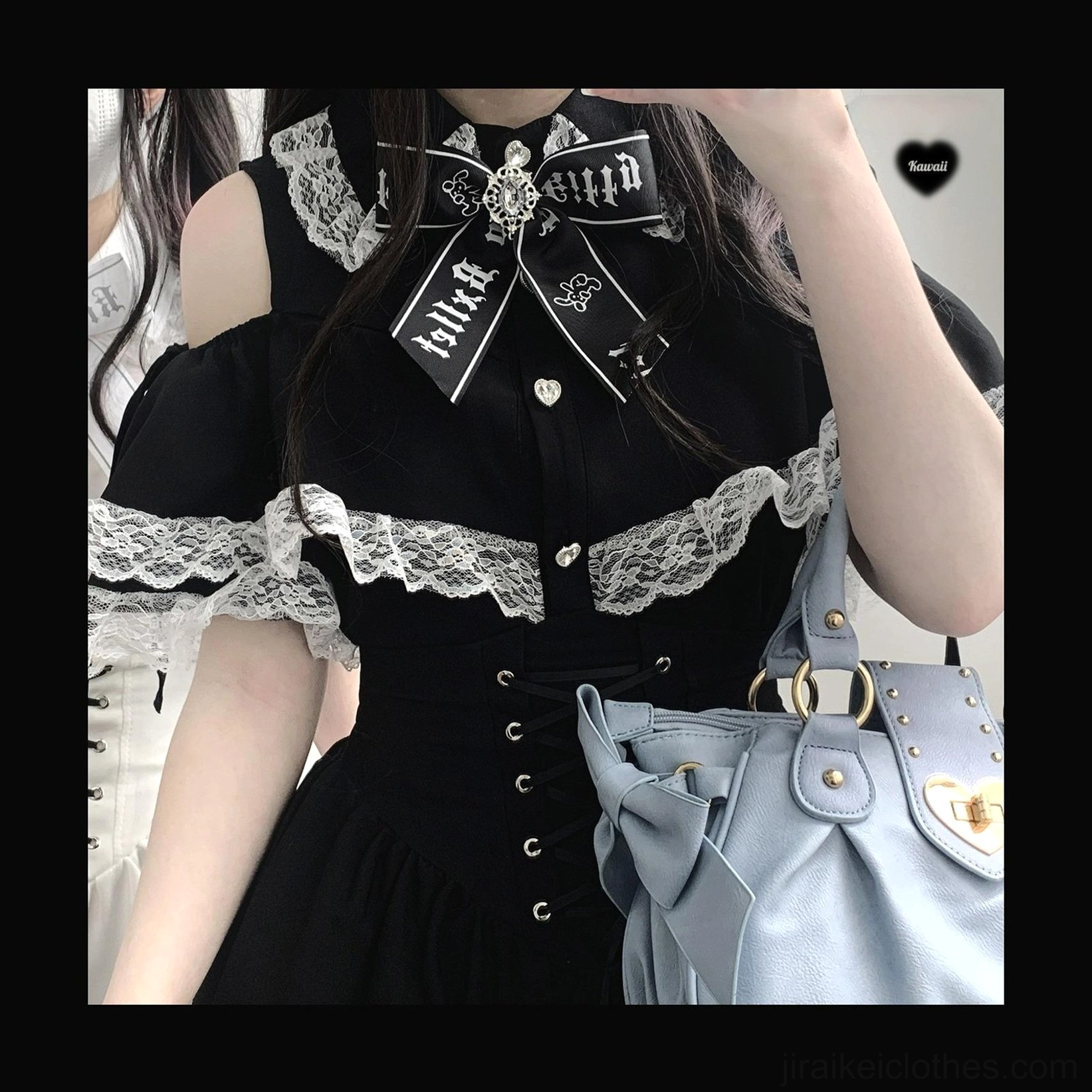 Close-up detail of Jirai Kei lace off-shoulder blouse showing lace collar trim heart buttons and embroidered bow brooch