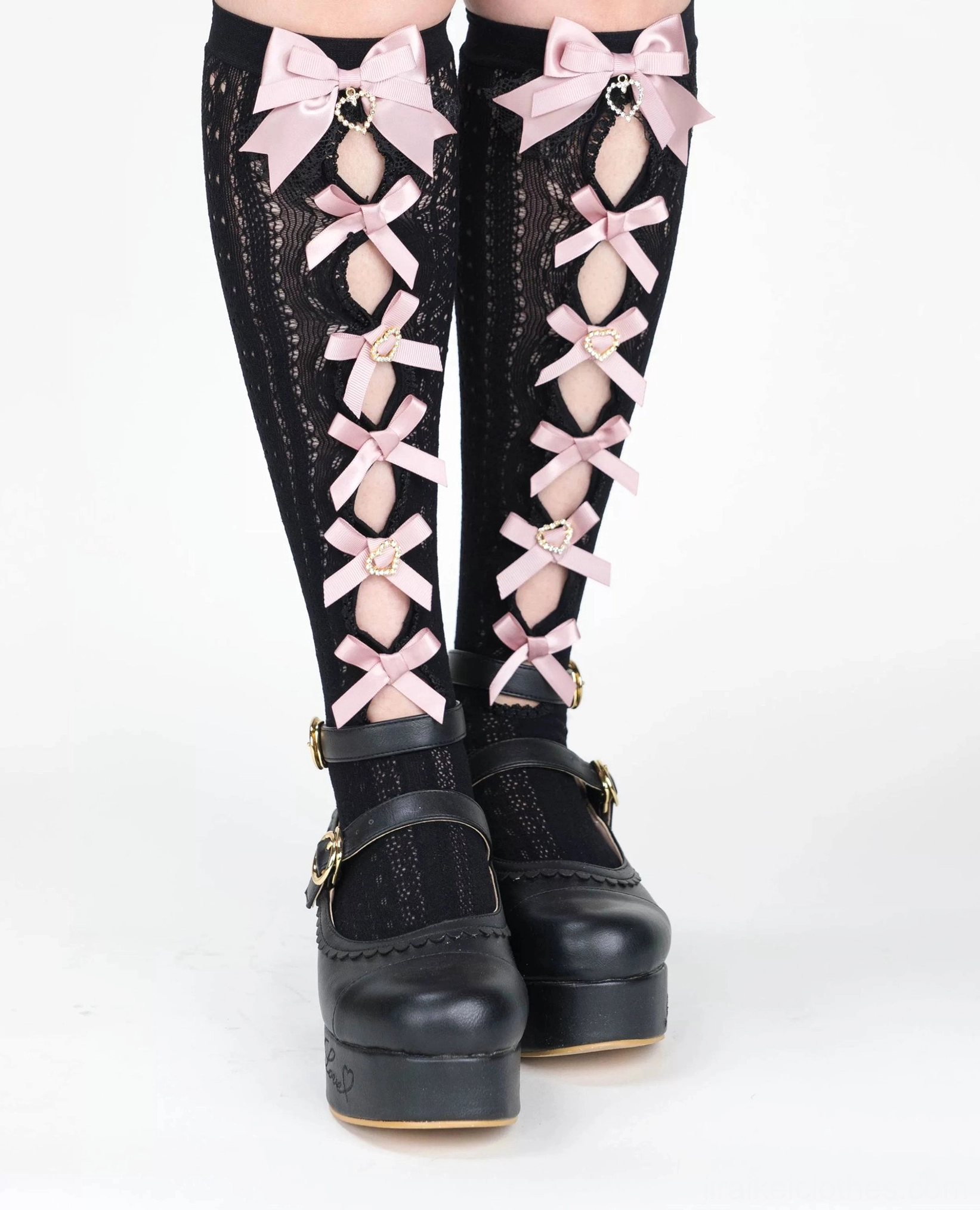Black Jirai Kei lace bow socks front view large top pink bow multiple front pink ribbon bows mid-calf length black platform shoes