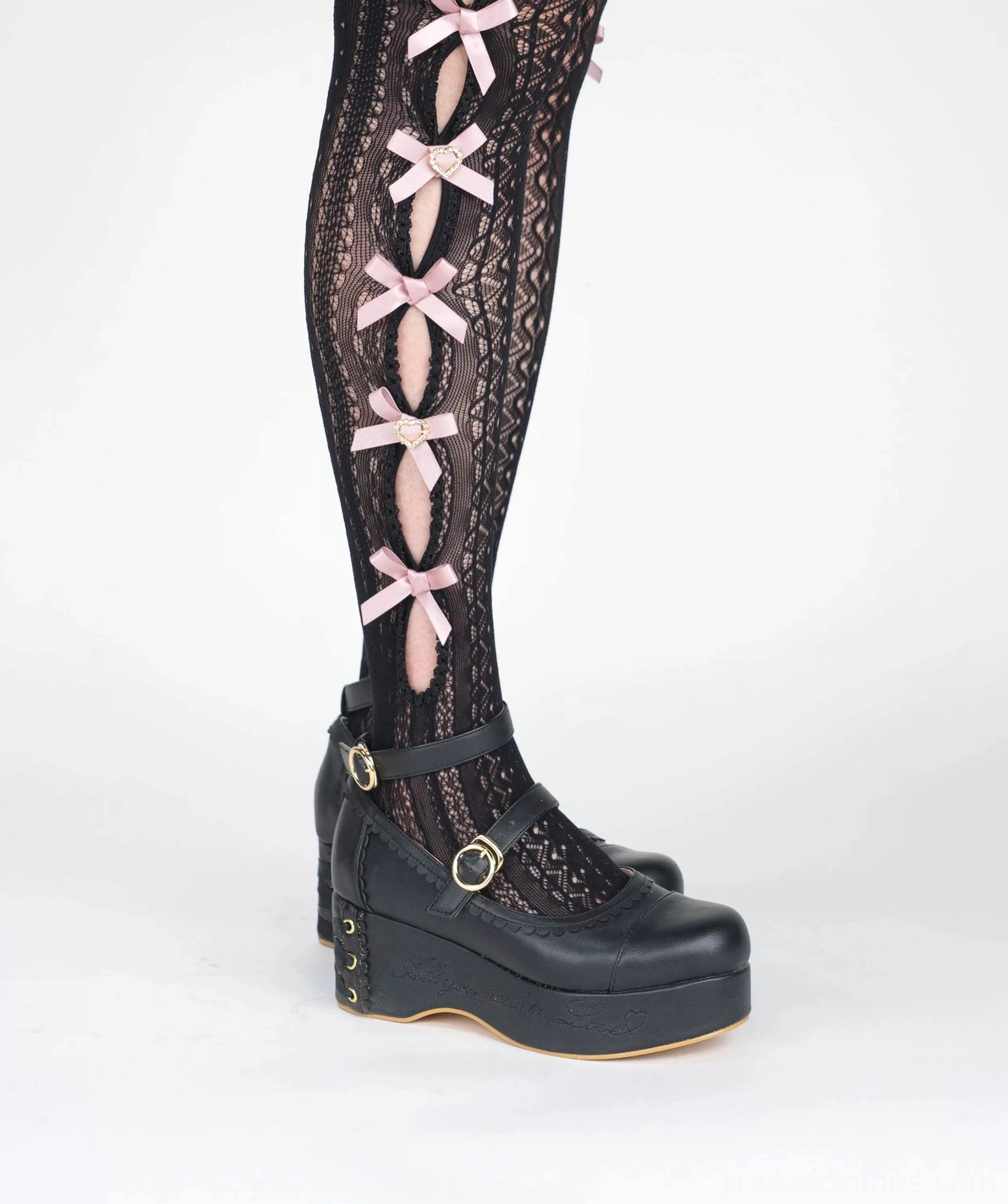 Black mid-calf Jirai Kei socks low side view feet pink ribbon bows hollow knit texture wedge platform shoe styling