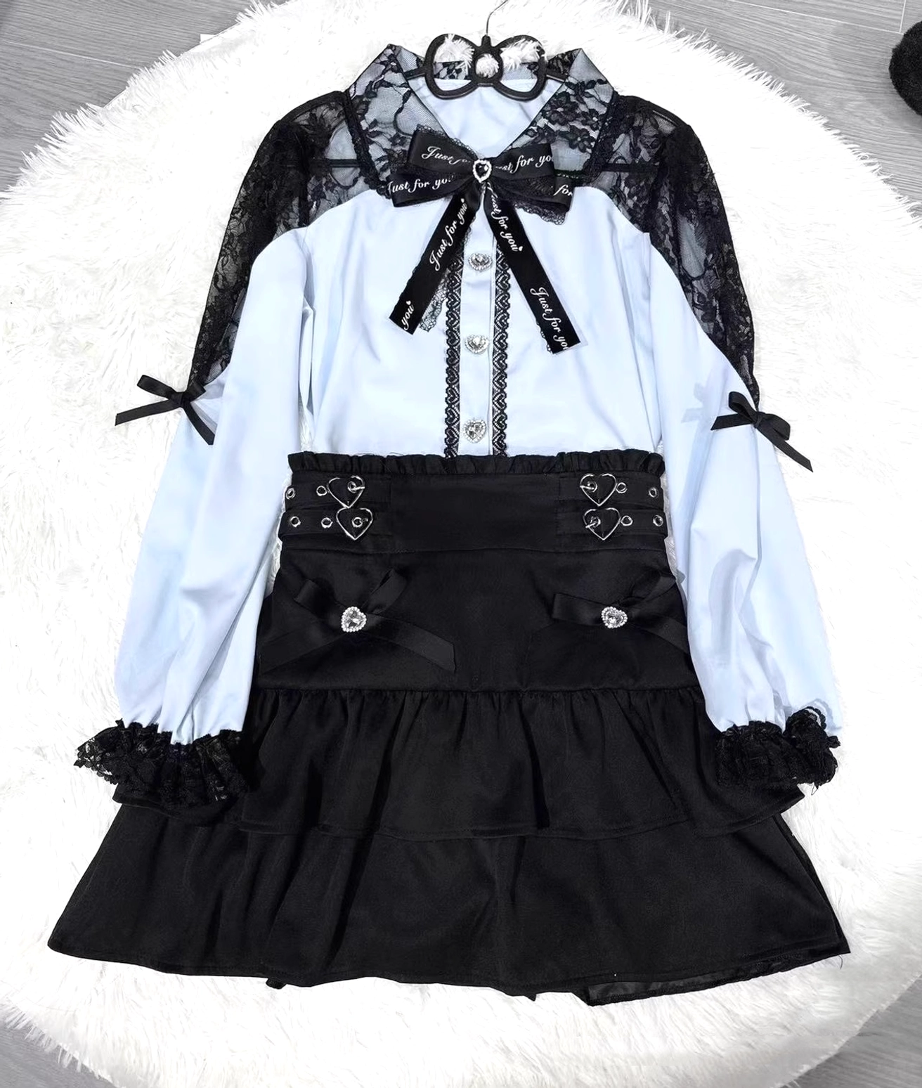 Jirai Kei lace blouse and tiered ruffled skirt set flat lay display showing lace peter pan collar and heart-shaped buckle strap details
