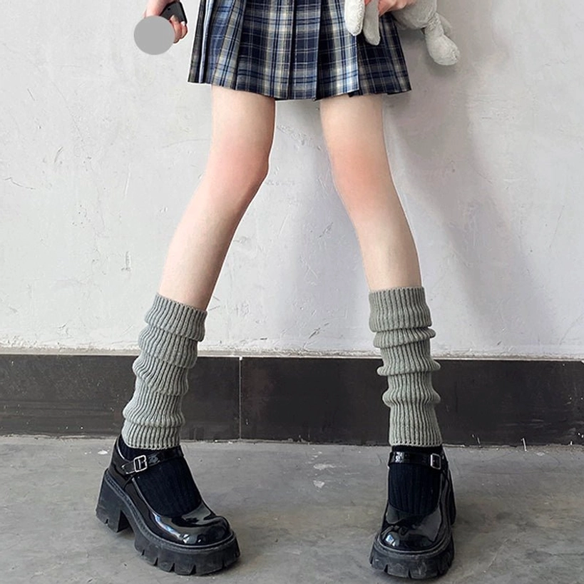 Grey heather mid-calf twisted stacked ribbed leg warmer jirai kei aesthetic styled with plaid skirt and mary jane loafers front angle view