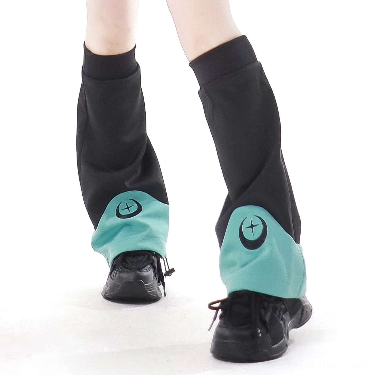 Lower leg view of black Jirai Kei leg warmers with teal cuffs crescent moon embroidery paired with sneakers stretch fabric detail shot