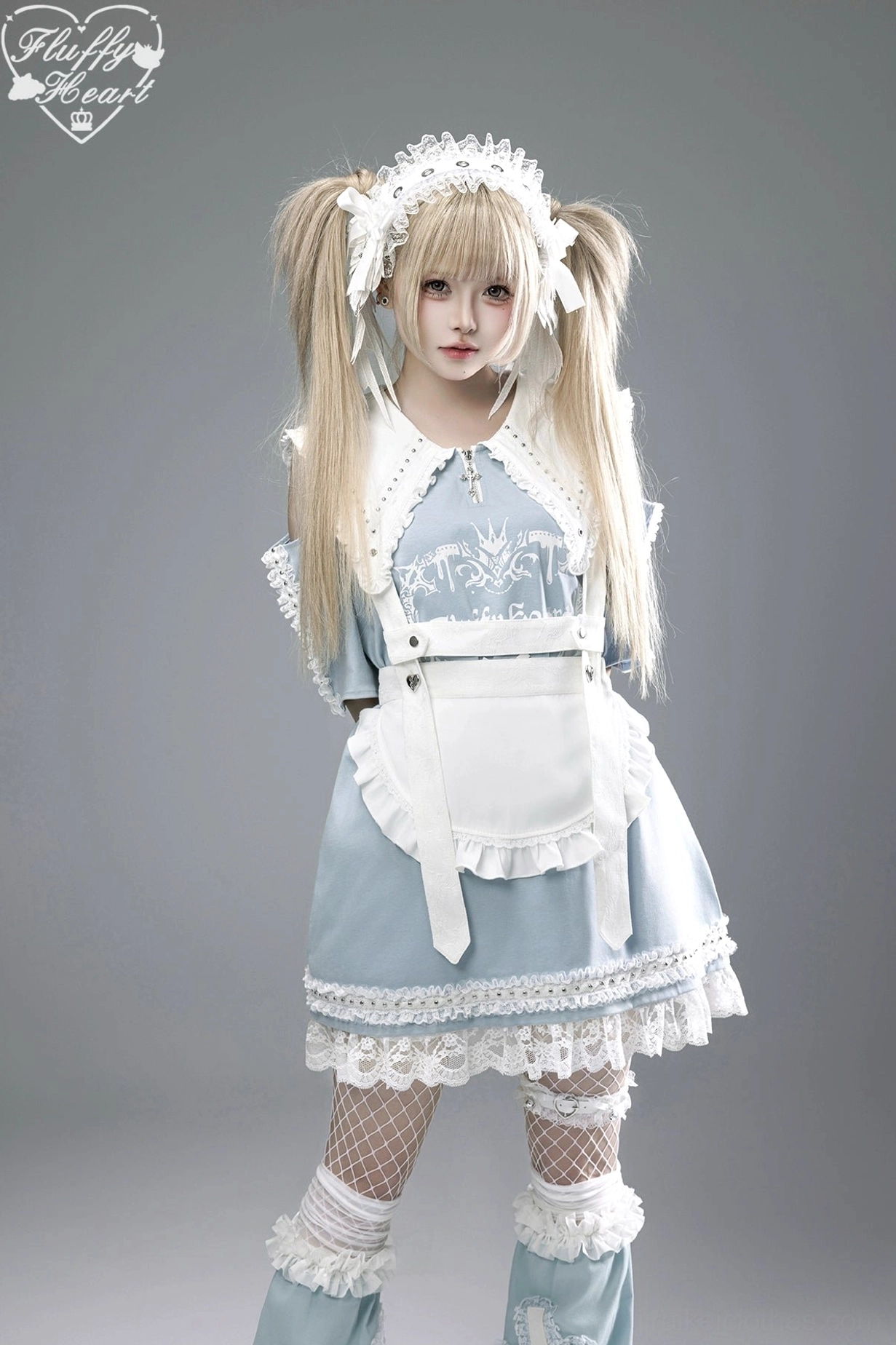 Light blue water blue Jirai Kei maid-style T-shirt dress with white lace trim, white apron, fishnet stockings, and ruffled leg cuffs, worn with twin tails