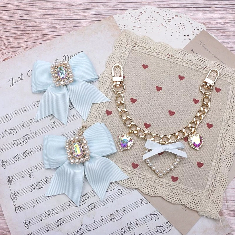 Light blue satin bow Jirai Kei bag charm rhinestones gold metal chain heart pendants