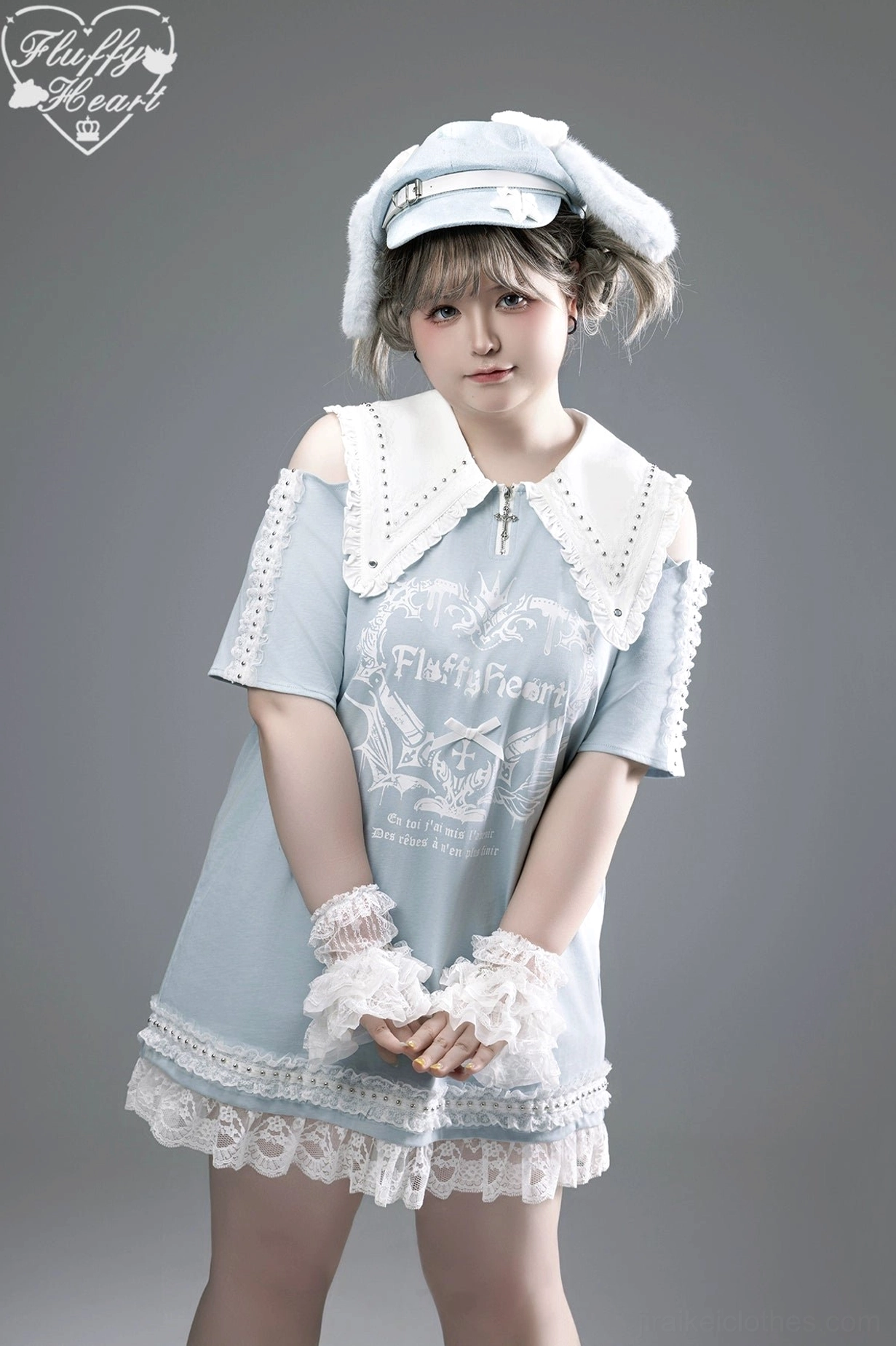 Light blue Jirai Kei off-shoulder T-shirt dress with white peter pan collar, lace-trimmed hem, brand gothic print, and white lace cuffs, half-body front view