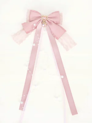 Light pink Jirai Kei hair clip featuring double-layer bow knot design with lace edging and long pearl-beaded ribbon streamers