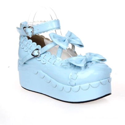 Sky blue leather Jirai Kei platform shoes with patent finish and scalloped sole edges side profile view
