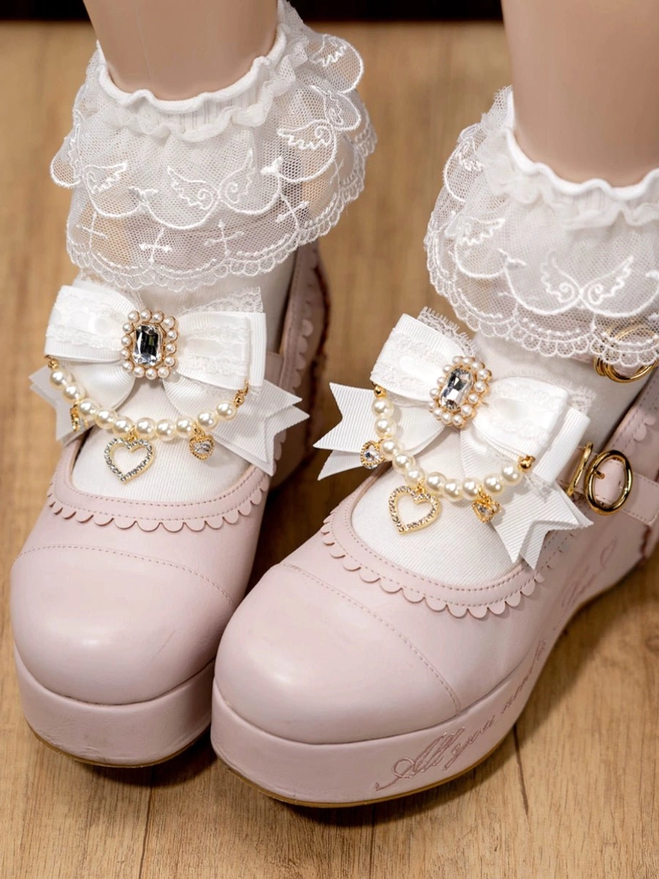 Lolita shoe clips set collection displayed on mannequin feet showing multiple bow styles with pearl rhinestone heart embellishments