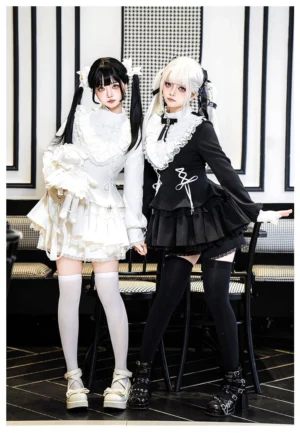 Twin model styling of Jirai Kei Lolita outfits with ruffled peter pan collar, bow tie, lace-up front details, and tiered ruffled shorts dress in size S