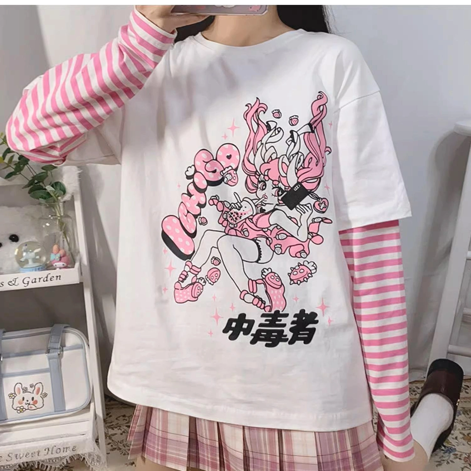 Jirai kei false two-piece long sleeve anime graphic striped punk tee detail showing sleeve construction method