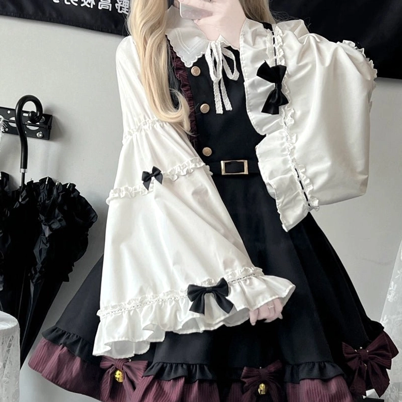 Long-sleeve trumpet blouse Jirai Kei component detailed view highlighting ruffled cuffs, bow decorations, and elegant white fabric construction