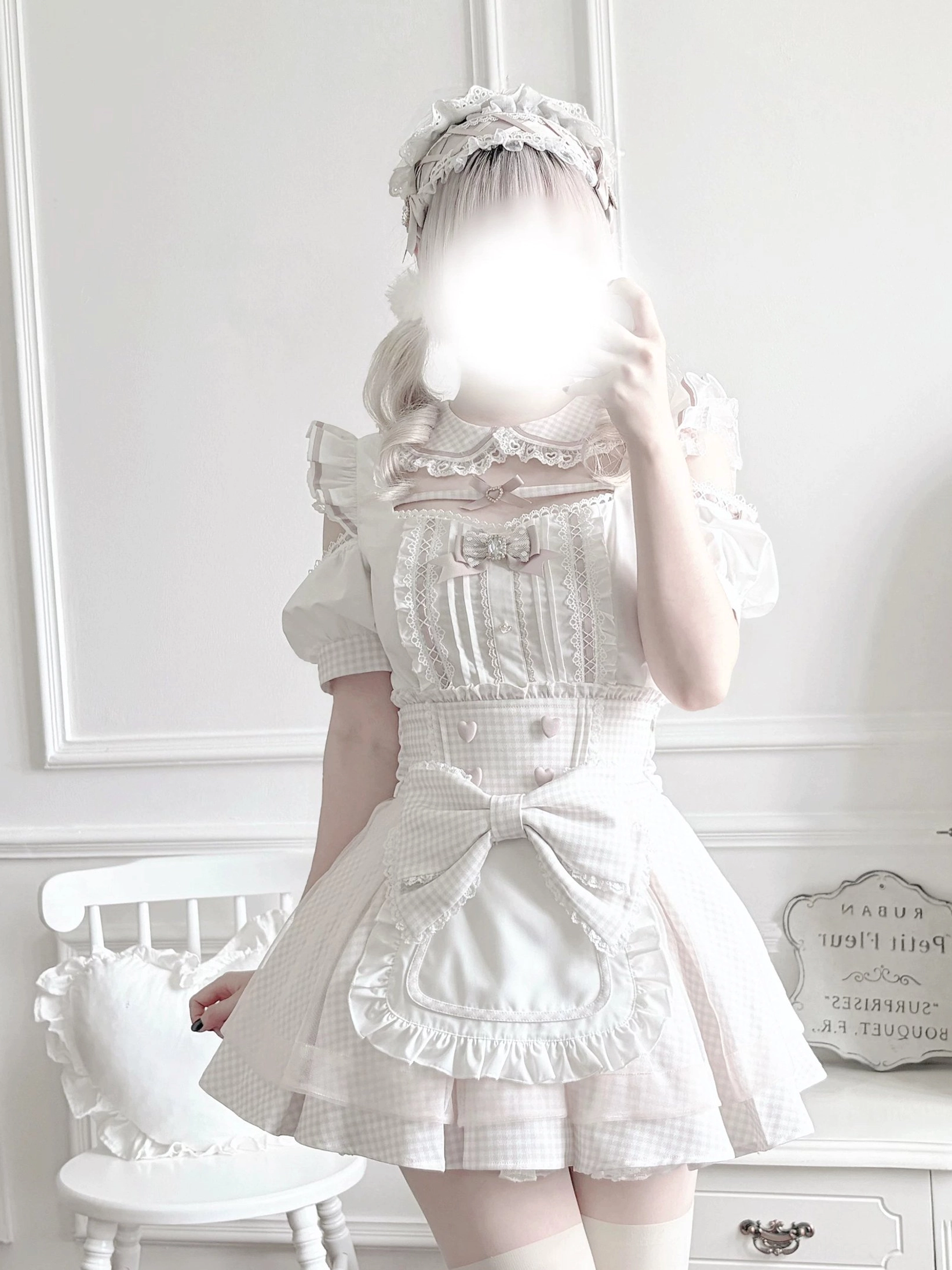 Styled overhead view of complete Jirai Kei maid outfit set with detachable apron, showing all component pieces and accessory coordination options