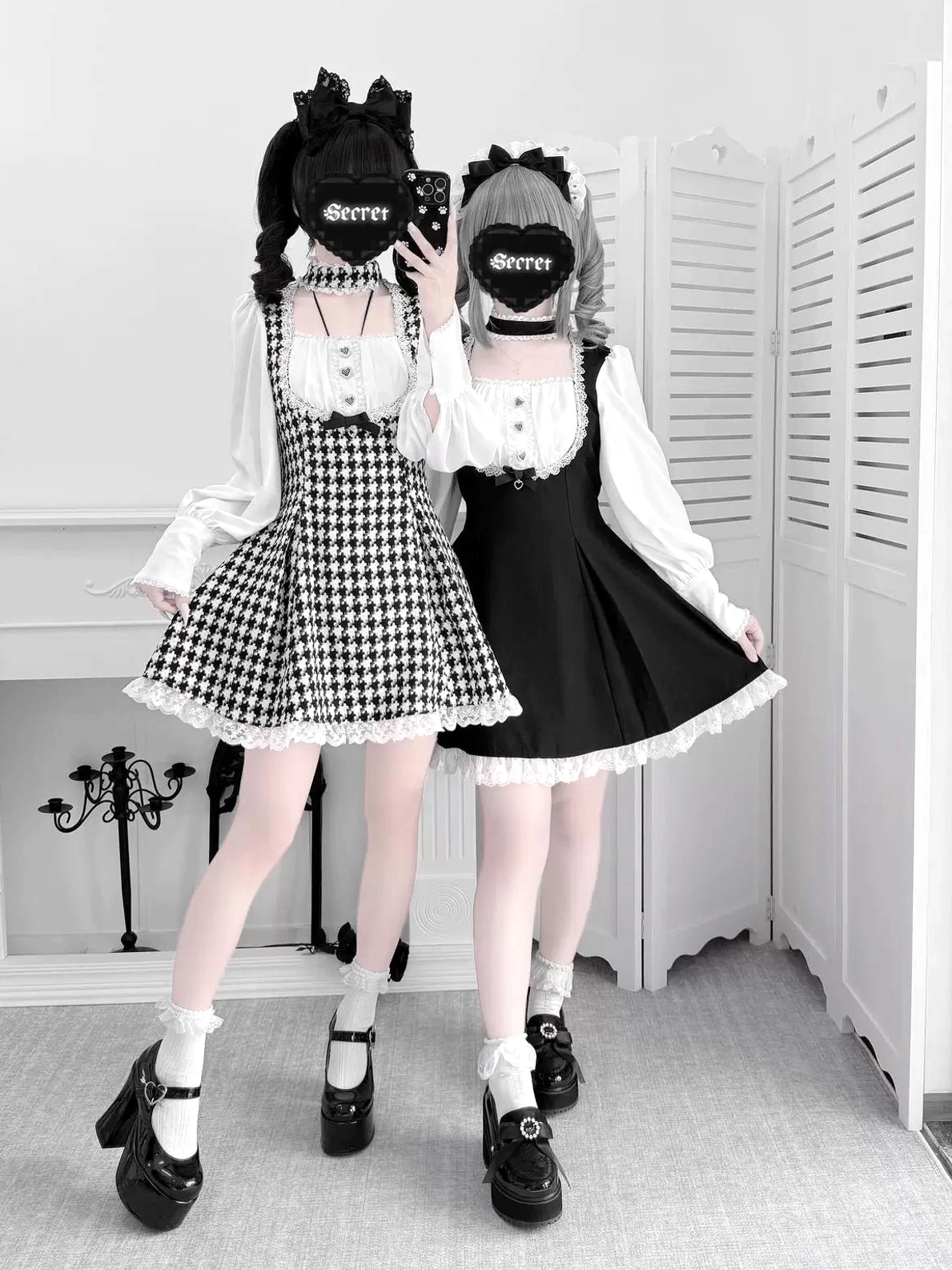 Full-body front view of houndstooth and solid black Jirai Kei maid dresses paired with Mary Jane shoes and lace-trimmed hems showing both color options