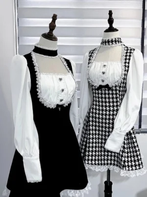 Eye-level front view of mannequin-displayed Jirai Kei maid dresses showing lace-trimmed bust, cuffs, attached non-detachable chokers, and two distinct fabric pattern options