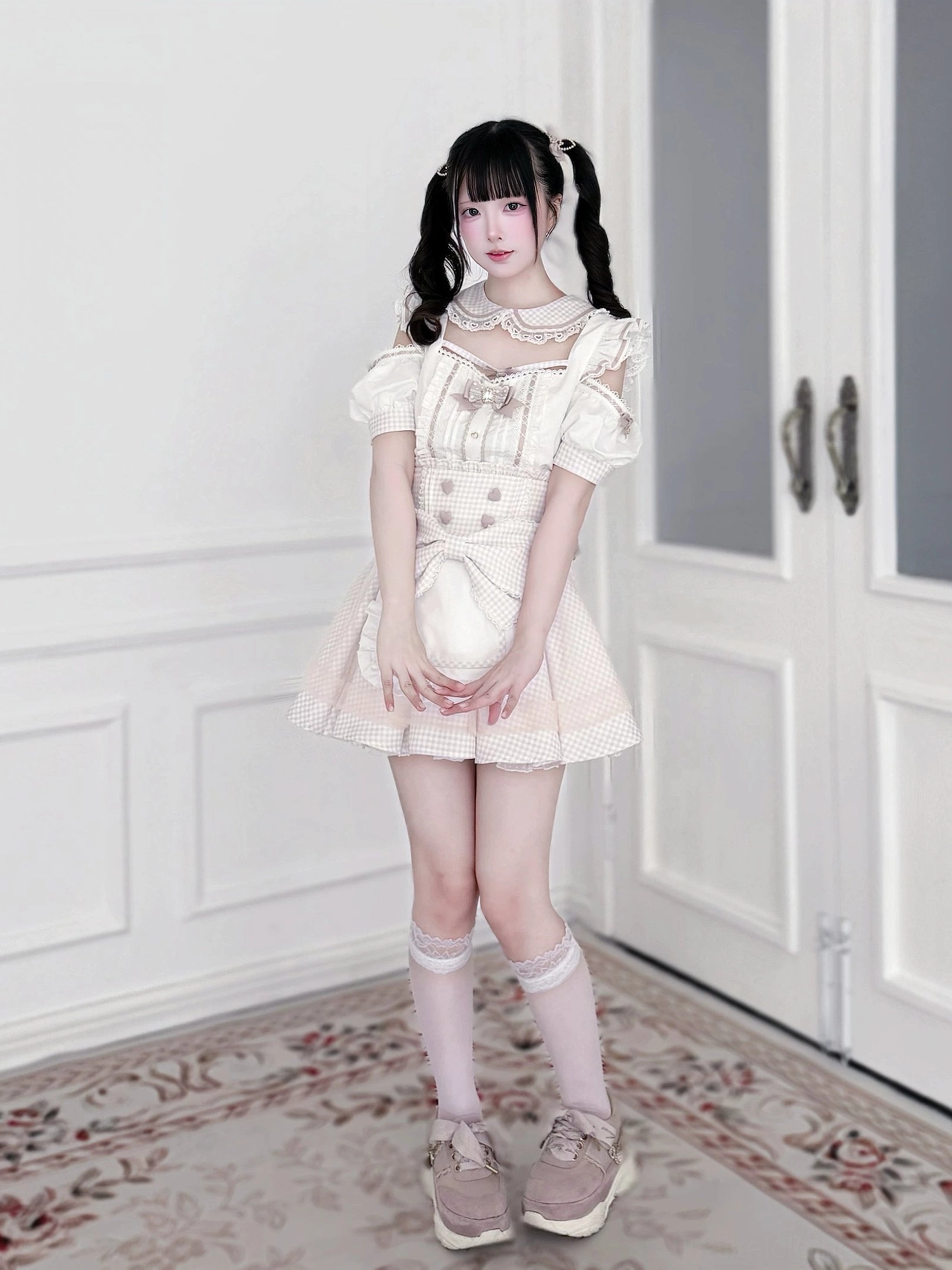 Packaged product presentation of Jirai Kei maid outfit set with all components including blouse, skirt, and detachable apron neatly arranged