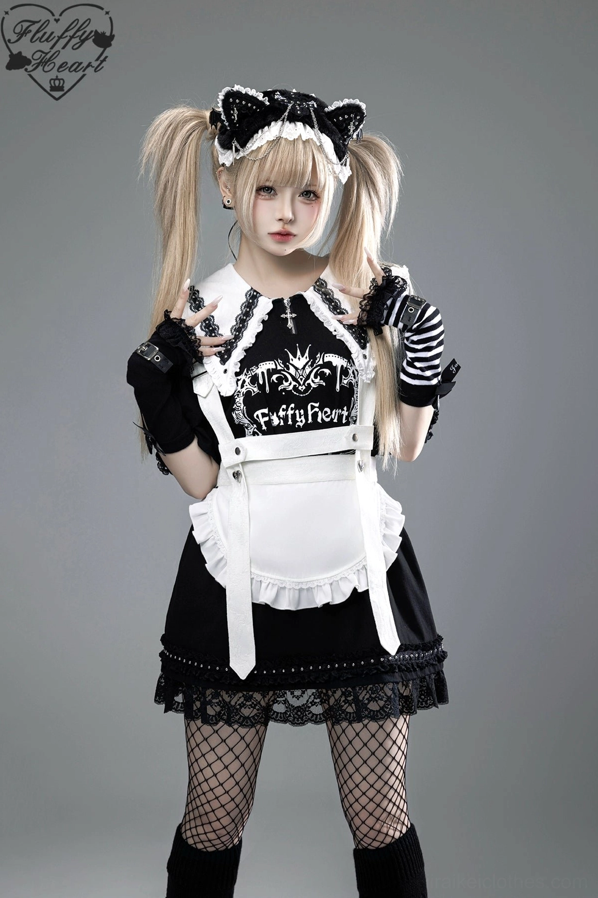 Black and white Jirai Kei maid-style T-shirt dress with lace collar, striped gloves, and fishnet stockings, styled with twin tails and cat ear headband