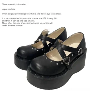 Jirai kei mary jane platform shoes with heart buckles and dual cross straps, black cowhide leather, studded details, side three-quarter pair display studio shot