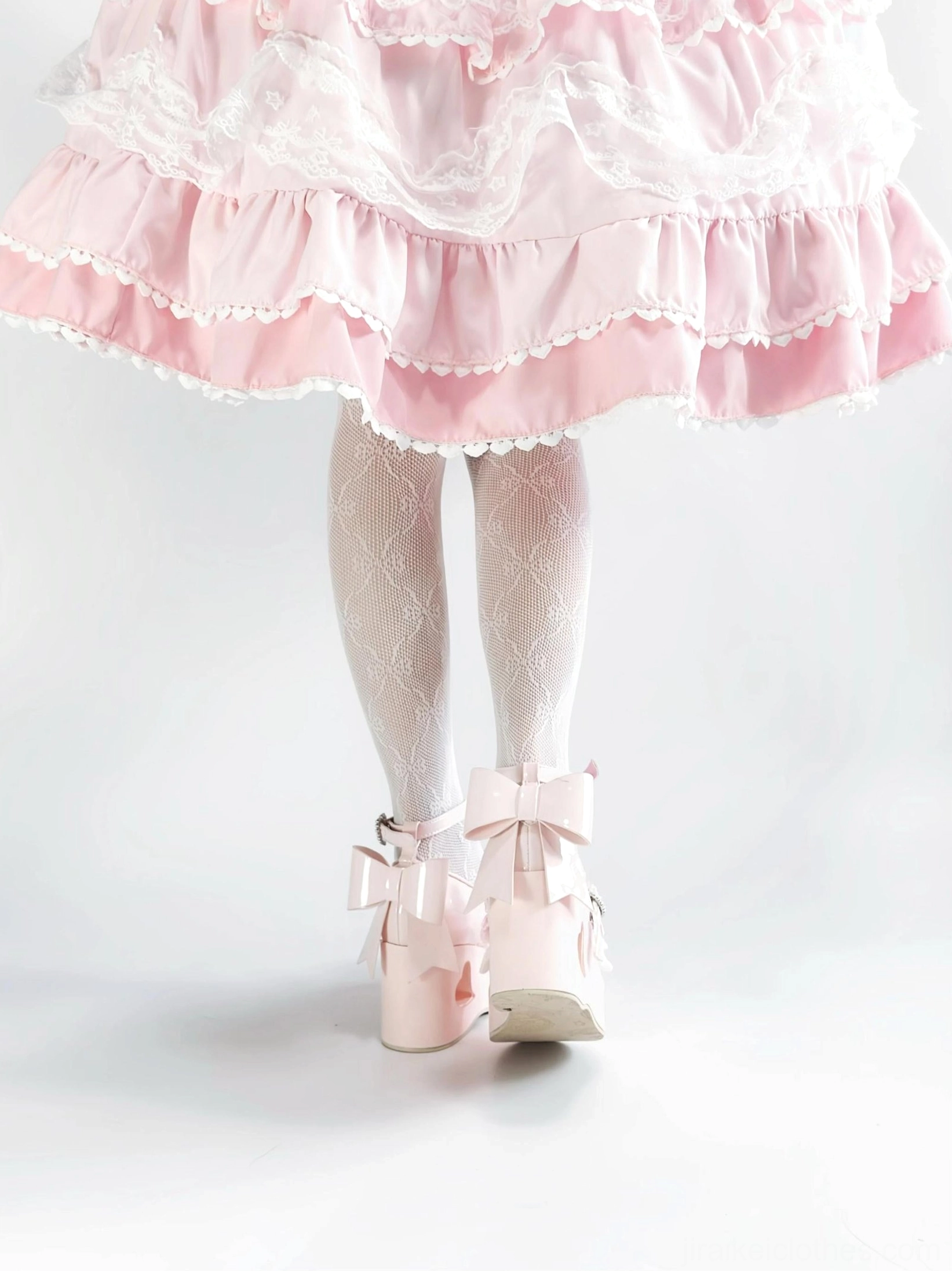 Jirai Kei platform Mary Jane shoe rear view emphasizing large satin bow with lace trim and heart-cutout heel signature design element