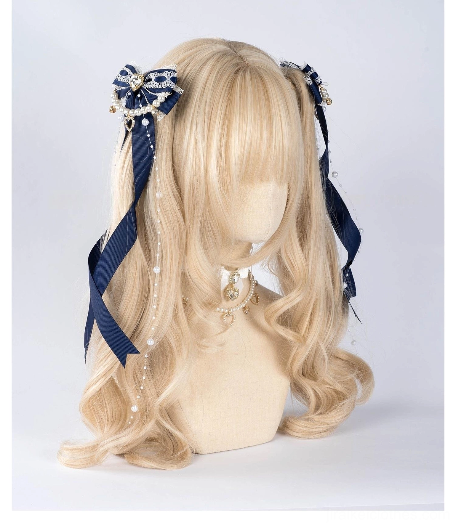 Jirai Kei dark navy blue bow hair clips with pearl chain trim and metallic decorative choker displayed three-quarter front angle on mannequin head