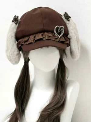 Brown Jirai Kei newsboy cap with grey detachable plush bunny ears and heart charm brooch, front view on mannequin with brown twin pigtails