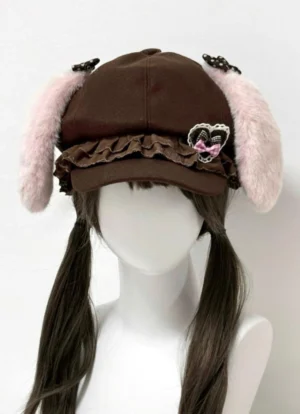 Brown Jirai Kei newsboy cap with cocoa pink plush bunny ears and pink bow heart brooch, front head-on view with ruffled brim detail