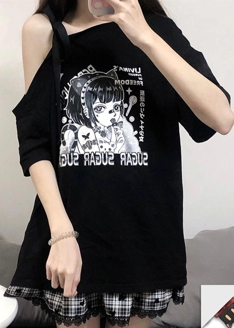 Close-up upper-body detail view of black off-shoulder anime print tee showing cold-shoulder cutout with adjustable bow strap and anime graphic on chest