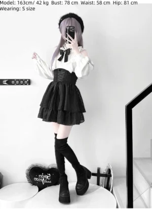 Full-length gothic lolita style jirai kei ensemble featuring apricot blouse and black high-waisted tiered skirt - complete front view full body shot
