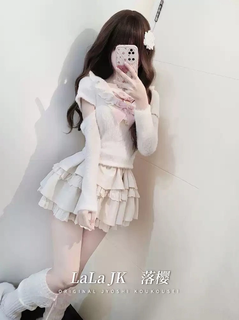 Jirai Kei sweater showcasing off-shoulder design with detachable long sleeves and ruffled collar, paired with tiered mini skirt and white leg warmers, demonstrating styling versatility of the ensemble