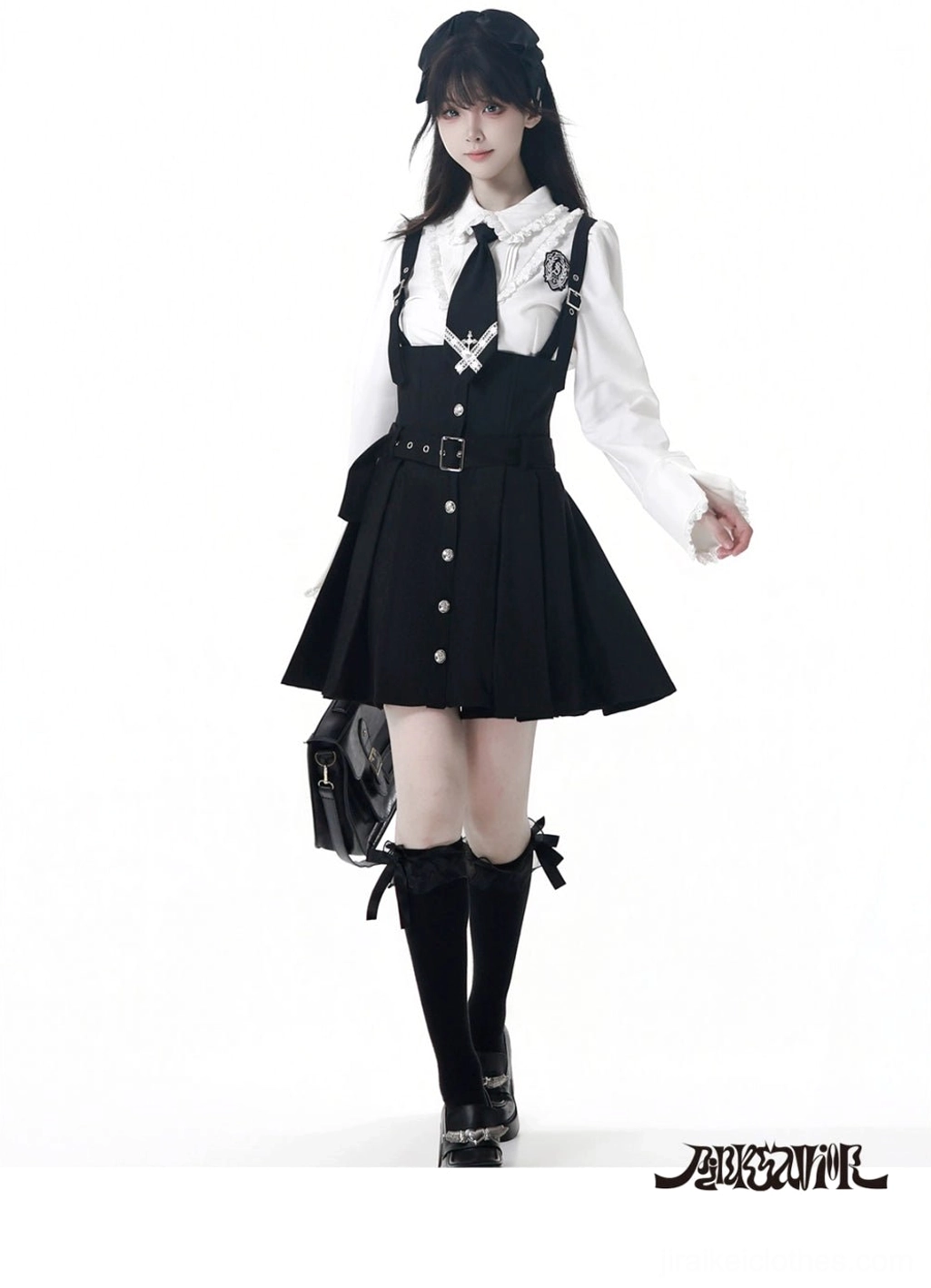 Jirai Kei JK overall dress set front three-quarter view showing metal button decorations, bow knee-high socks, leather school bag, and complete uniform styling on female model