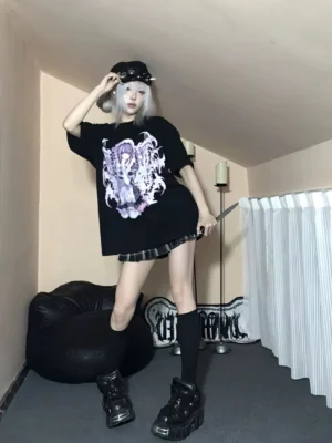 Full-body front view of oversized Jirai Kei black anime maid graphic cotton t-shirt on silver-haired female cosplayer model, showcasing relaxed drop-shoulder fit and gothic print design